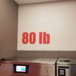 Custom routed interior signage for laundromat